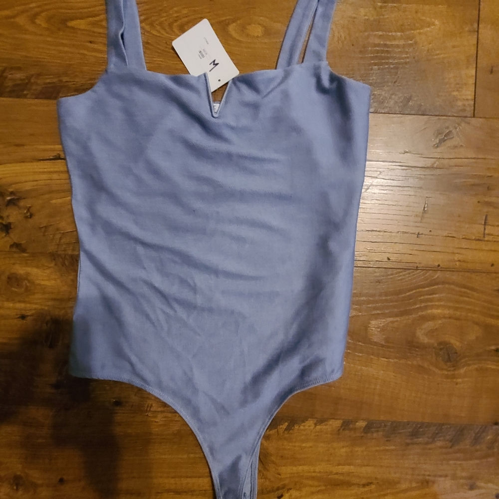 Cute dusty blue body suit with V in the middle